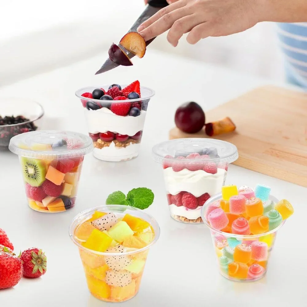 Pack of 100 StackMan 5.5 oz clear premium-quality plastic cups with flat lids